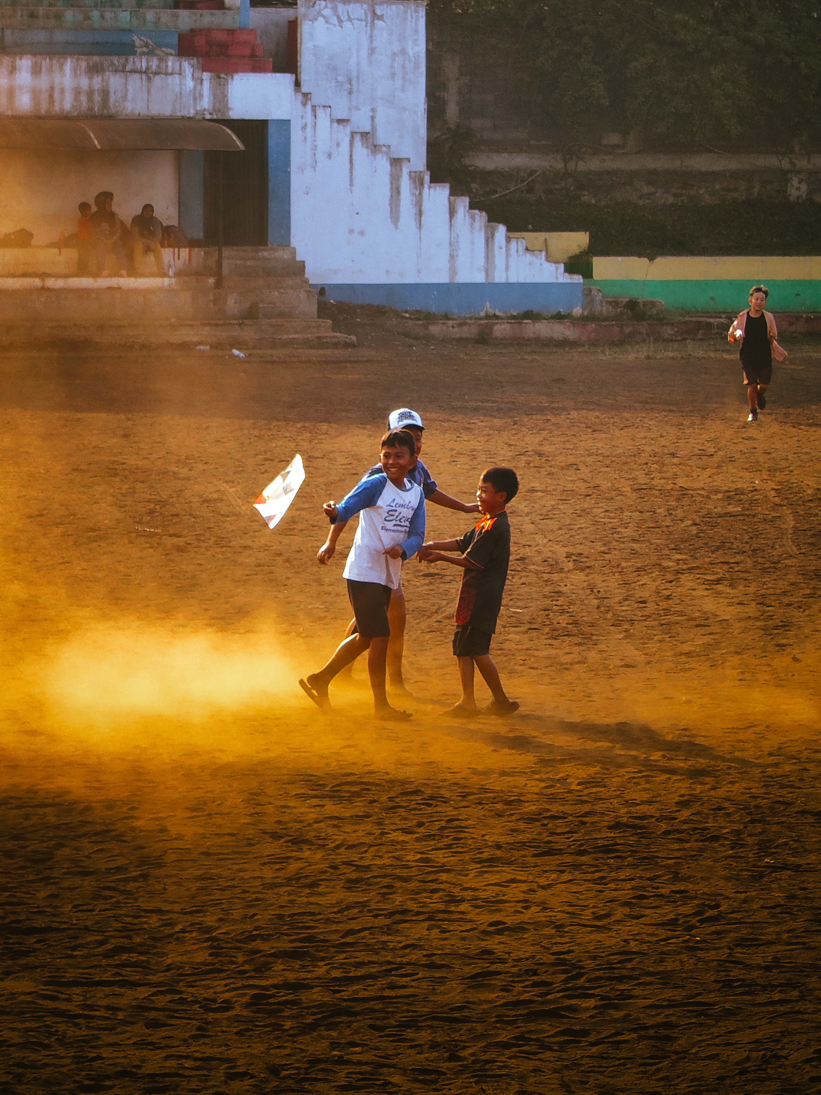 Today I saw a lot of children playing kites in a field full